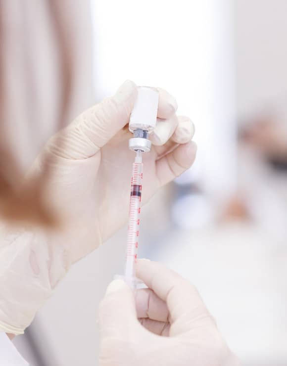 Doctor prepping birth control shot