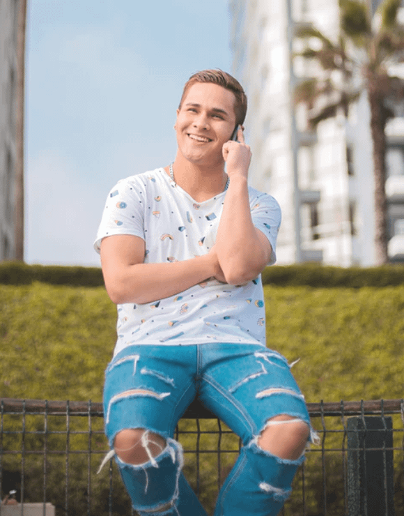 A young man practices self-care by taking time to talk to a friend