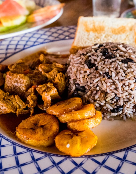 Costa Rican Gallo Pinto with fried plantains, rice and beans, and pork or chicken