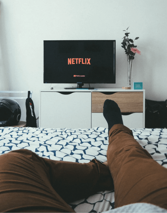 A man demonstrates Netflix and Chill as a form of self-care