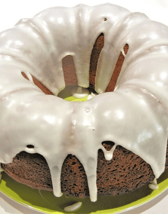 Whole grain Apple Spice Bundt Cake glazed with vanilla icing