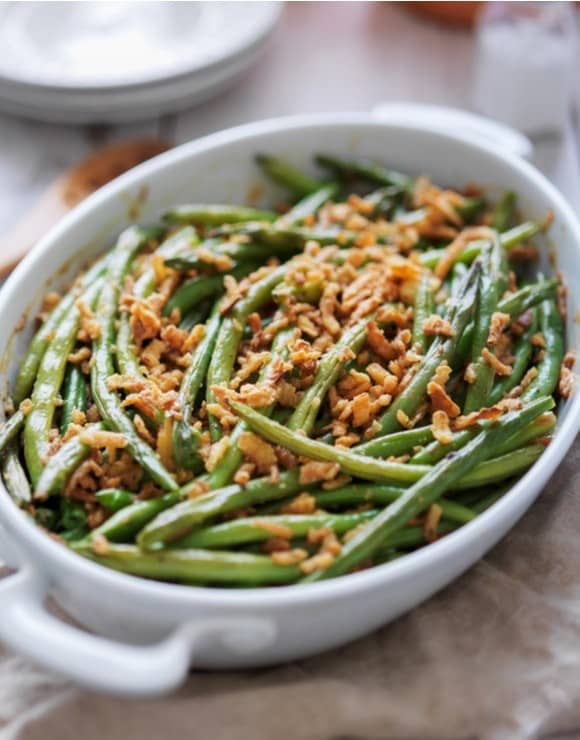 Healthy green bean casserole baked in a glass dish