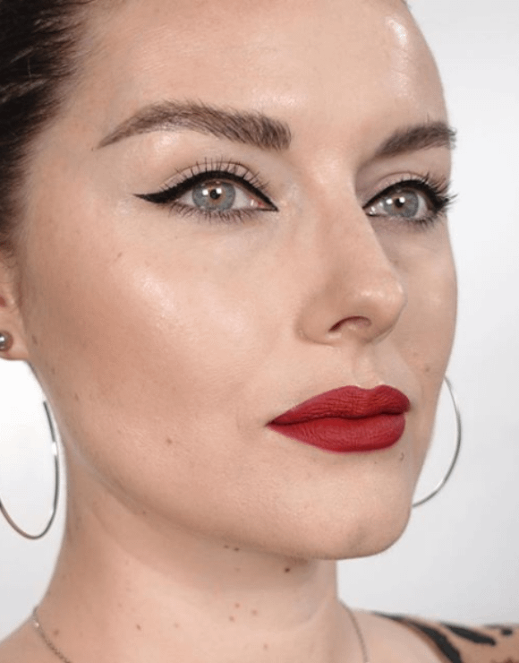 Woman modeling retro glam makeup style