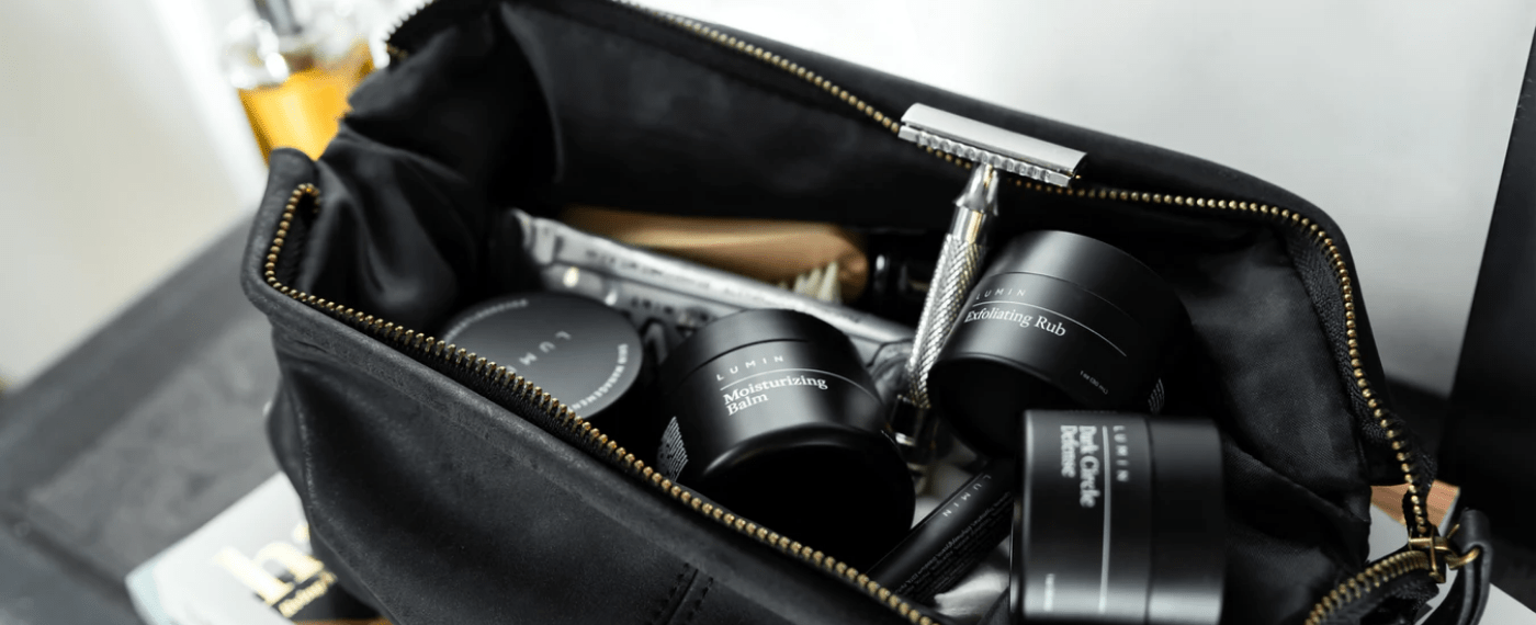 a travel bag full of luxury skincare products