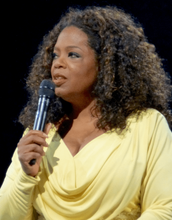 Oprah Winfrey holding a microphone