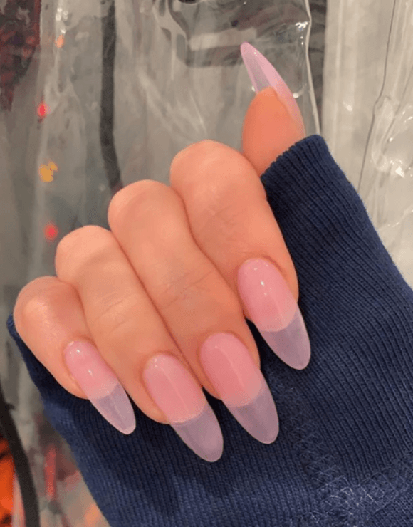 up-close shot of trendy manicure with sheer nail polish