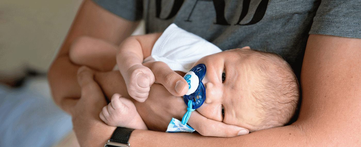 new dad holding baby